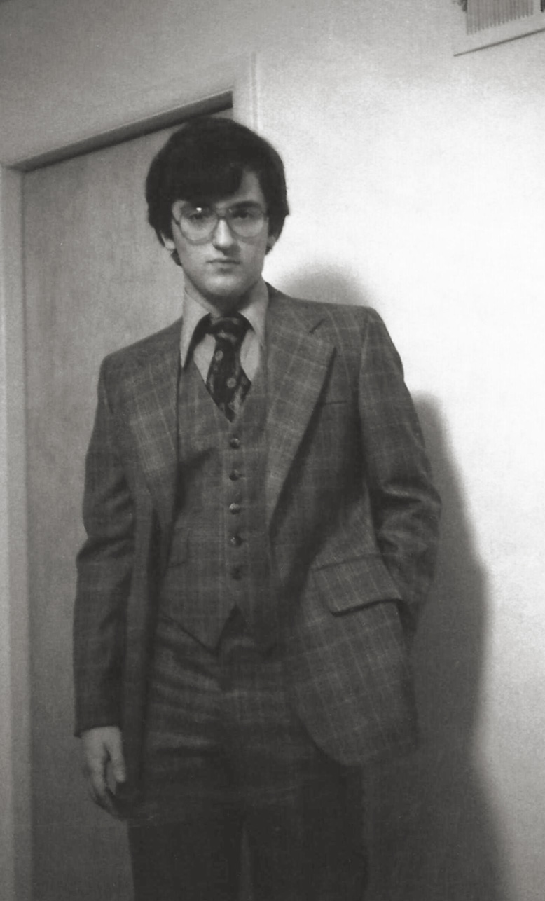 My then teen-aged brother Iden, continues the non-smiling tradition into a third generation, posing for a formal oil paint-like portrait in three piece suit. Since I moved to California when he was in late elementary school, I have no clue what the occasion for the suit was. I only know I scanned it from a Polaroid print. View full size.
