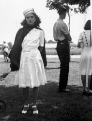 Estelle Eberius poses after the Memorial Day parade in Uniondale, New York, late 1940s. I don't recognize the uniform. Most likely a ladies auxiliary. American Legion or fire department. View full size.
(ShorpyBlog, Member Gallery)