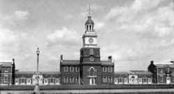 Another from my collection. Independence Hall I figure in the 1930's. From another source, this is the south side of the building.  View full size.
Not Independence Hall...Nice photo but it's not THE Independence Hall in Philadelphia. It looks like one of the replicas -- maybe the one at the Henry Ford Museum in Michigan? The real hall doesn't have so many side buildings, and on that side of the building is a full block-sized park that has been there since way before the 1930s. 
There is also no road that close to the hall on that side. Just lots of trees and a few statues. (I would have attached an old postcard from the 1930s but it wouldn't load to the email.) Anyway, just for what it's worth!
(ShorpyBlog, Member Gallery)