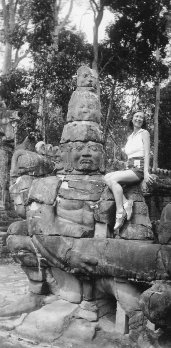 Gladys Wagner posing with statue, Indo China, 1939. View full size.
