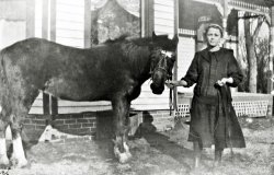 This is my father's mother at home in Muscatine, Iowa about 1922. She was born  Iona Gettert in 1900. A few years later she married Hans Frederick Larsen, seen in this photo with his Jewell Tea truck. View full size.
(ShorpyBlog, Member Gallery)