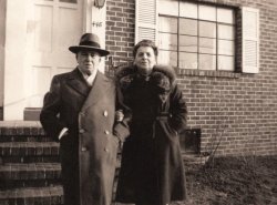 These are my mother’s parents Issar and Marie, thirty years after the cigar and rocker photo, visiting the New Brunswick, New Jersey garden apartment where my own, then newly-wed, future parents lived from late 1951 until 1953. (A photo of my parents taken on this same day is here). They had both come from eastern Europe, he around 1905 and she around 1913, and met while working in the garment trade of New York City. They married in 1923. I never met him; he died the year before I was born.  She seems to stand so tall and proud in her fur collar coat. The woman I met could not stand straight due to severe osteoporosis, which gave her a hunched back. Photo was probably taken by my mother. Scan was made from a print. View full size.