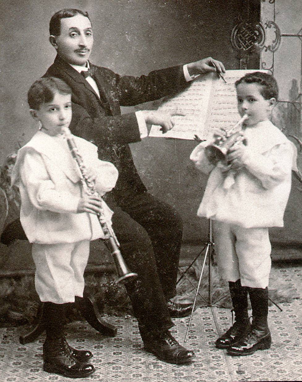This picture shows three members of the Shilkret family - Jack, his father Wulf (William) and brother Harry - probably around 1902. Jack, my grandfather, was born in 1896, and he appears to be about six in this photo, hence the date. He was an orchestra leader in the 20's through the 40's, and had several radio shows during the 30's. He composed popular songs and, among other things, did the background music for a number of the Fitzpatrick Travel Talks ("as the sun sinks slowly in the west..."). In addition to his work under his own name, Jack and Uncle Harry both recorded many records with their older brother Nat's RCA Victor orchestra, with Jack on piano and Harry on trumpet. View full size.