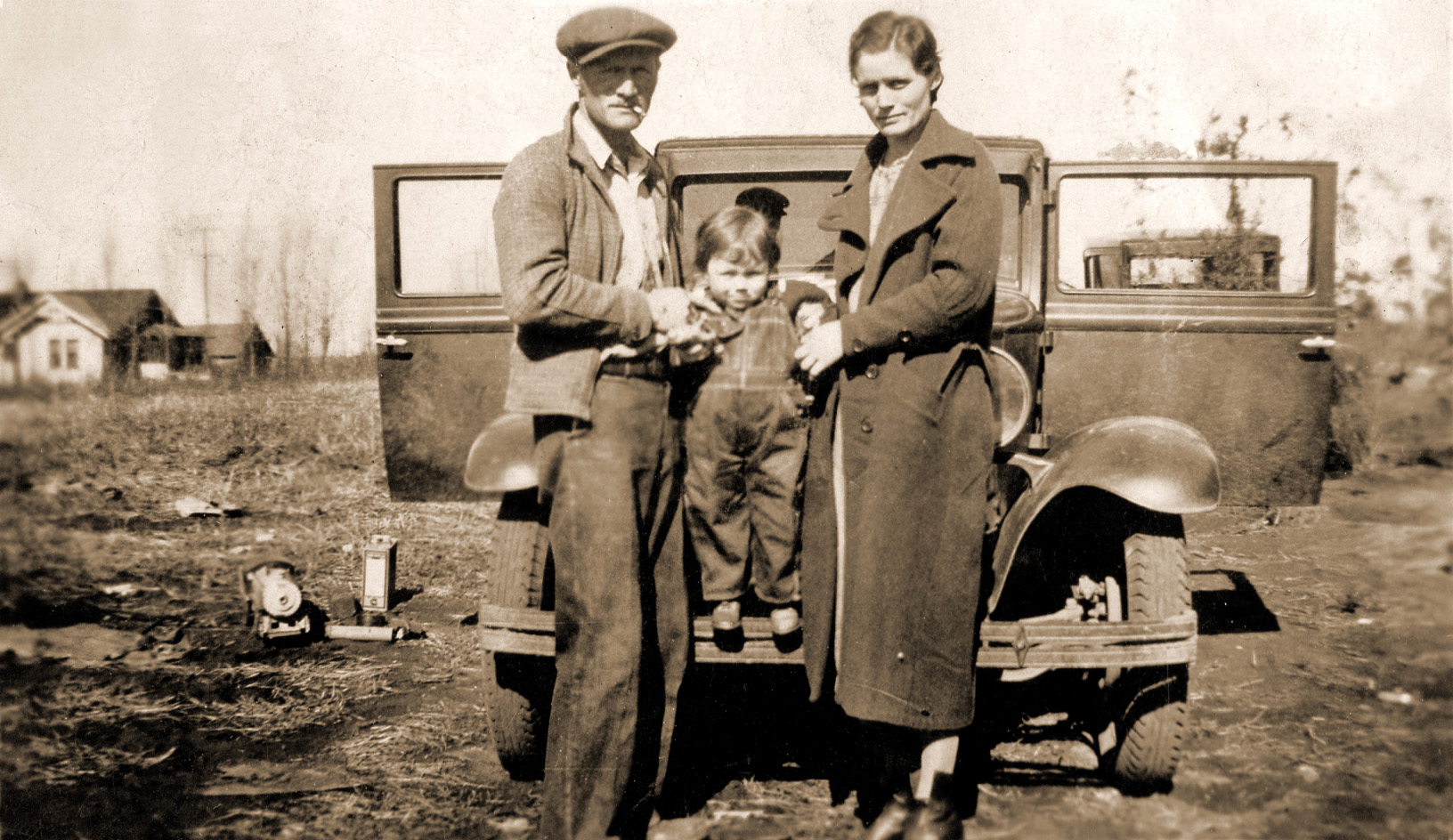James Cecil Upton with wife Amy Eddy-Upton and baby Rosalie. Claremore, Oklahoma 1938. View full size.

[Relatives of yours? -tterrace]