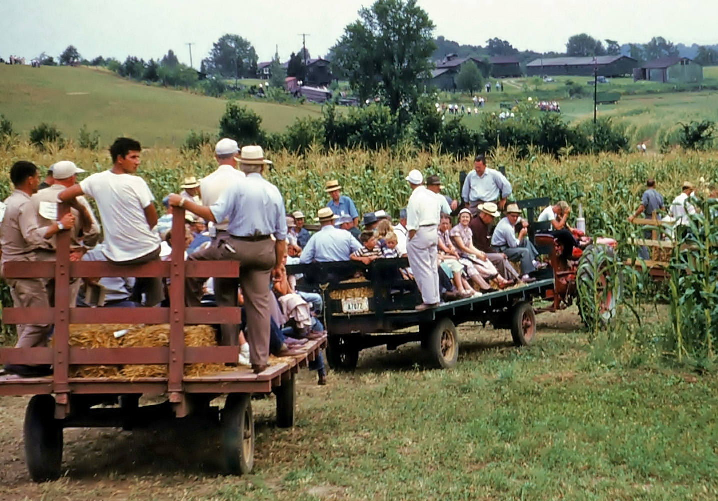 Hay wagons taking visitors to a local agricultural show on a farm in Coshocton County, Ohio in 1957.  From my grandfather's Kodachrome slides. View full size.