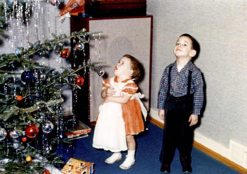 Christmas is a wonderful time for young children. My daughter and son were 2 and 4 when this was taken in 1956 and it is one of my favorites. The awestruck expression on Janet's face and her brother Roy's sly look of skepticism say it all! View full size.
