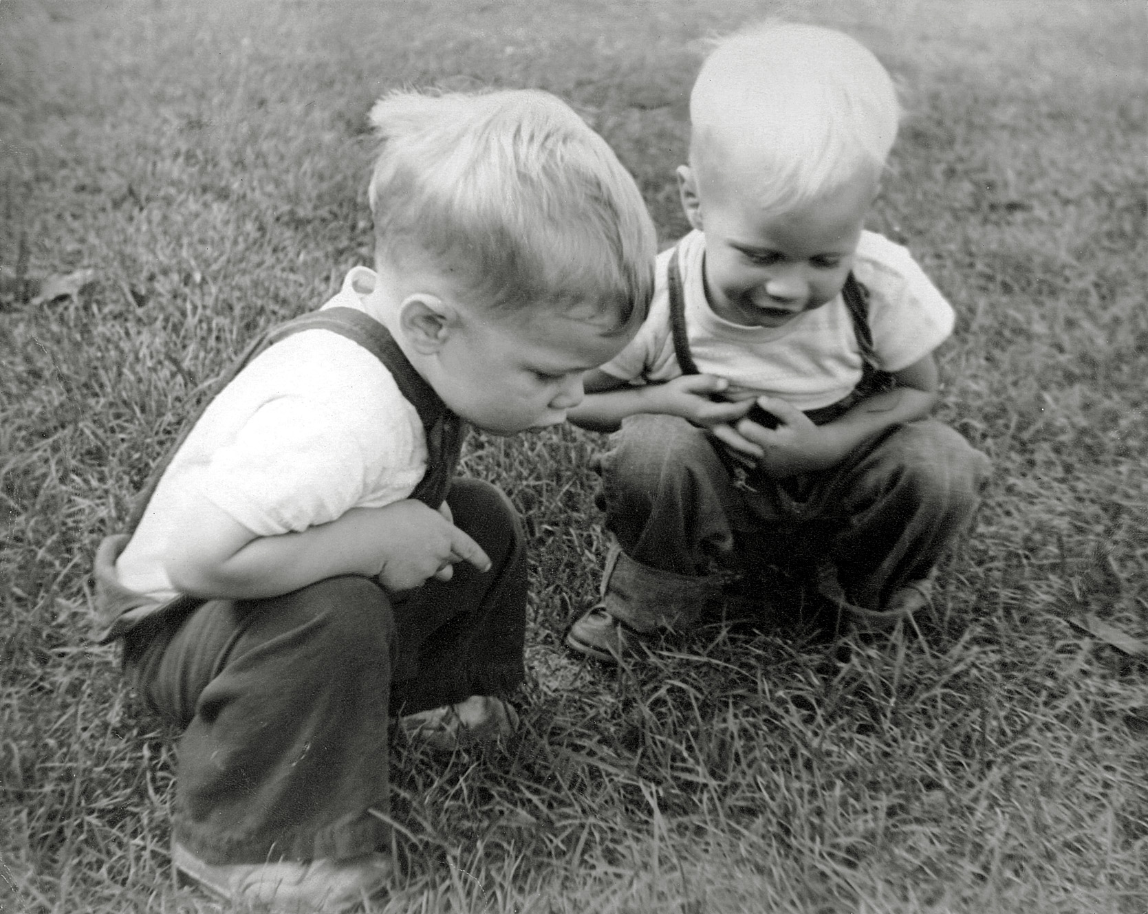 No one remembers what we were looking at, but Dad came away with a great photo. I’m the guy on the right and just turned two in the summer of 1949. Our neighbor from down the street is on the left. We were living in Rochester, New York at the time of this photo. View full size.