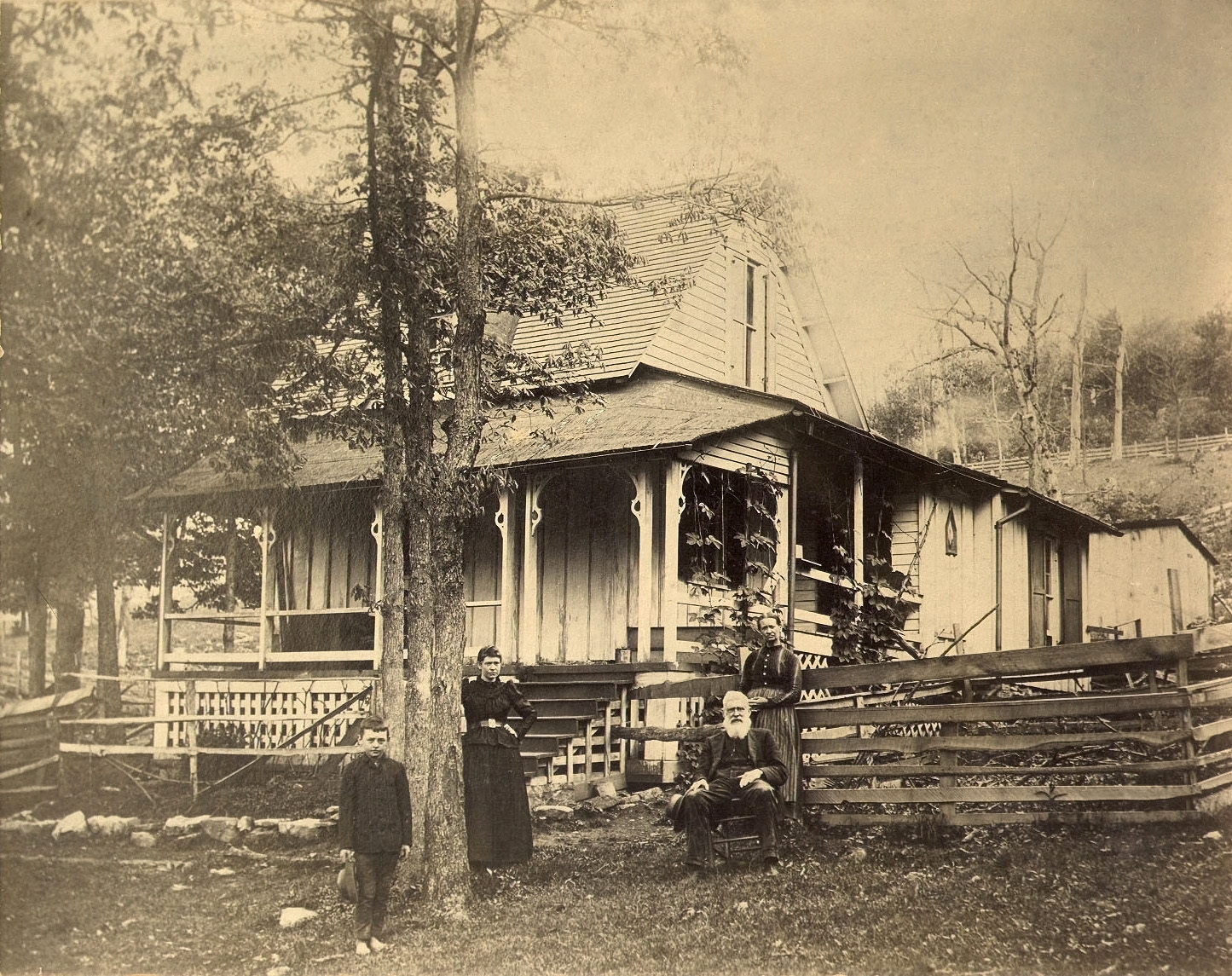 Photo taken circa 1895 in Terra Alta, West Virginia. At right are my great-grandfather and great-grandmother, John and Catherine Hewitt, with their daughter Eudora Hewitt and a grandson standing at left. The house is very unusual as the top or upper half looks as though it was an add-on. View full size.