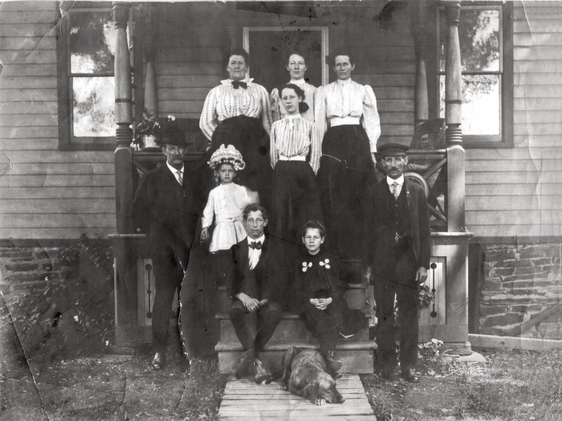 Cortland, New York. September 1909. My grandmother is in the center on the top step with my great grandmother to her left and my great grandfather on the ground at right.
