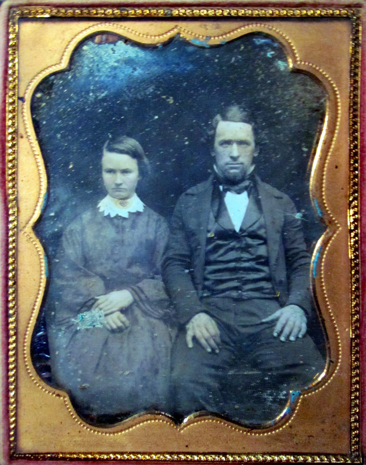 This is my first post to Shorpy, so I may as well start with the oldest of the photos I have inherited from my grandparents. This is a daguerreotype of my great-great-grandparents, Maria R. Vaughan and Martin Van Buren Jones on their wedding day in Marion County, Oregon, Oct. 29, 1854. They met and fell in love while crossing on the Oregon Trail in 1852 when he was 21 and she was 14. He was traveling alone, while she was with her parents and siblings, who settled SW of the Portland area. He went down the coast to just south of the California/Oregon border, where he settled and became one of the founders of Crescent City, California. Once settled, he went back north, married her, and brought her back to Crescent City, making her the first bride there. They went on to raise a large family. He was born in New York state in 1831 and died on his timber claim near Klamath, Del Norte County, California, on March 31, 1884. She was born in Peoria, Illinois,  Dec. 14, 1837, and died in Crescent City on June 6, 1926. I grew up in her old house. View full size.