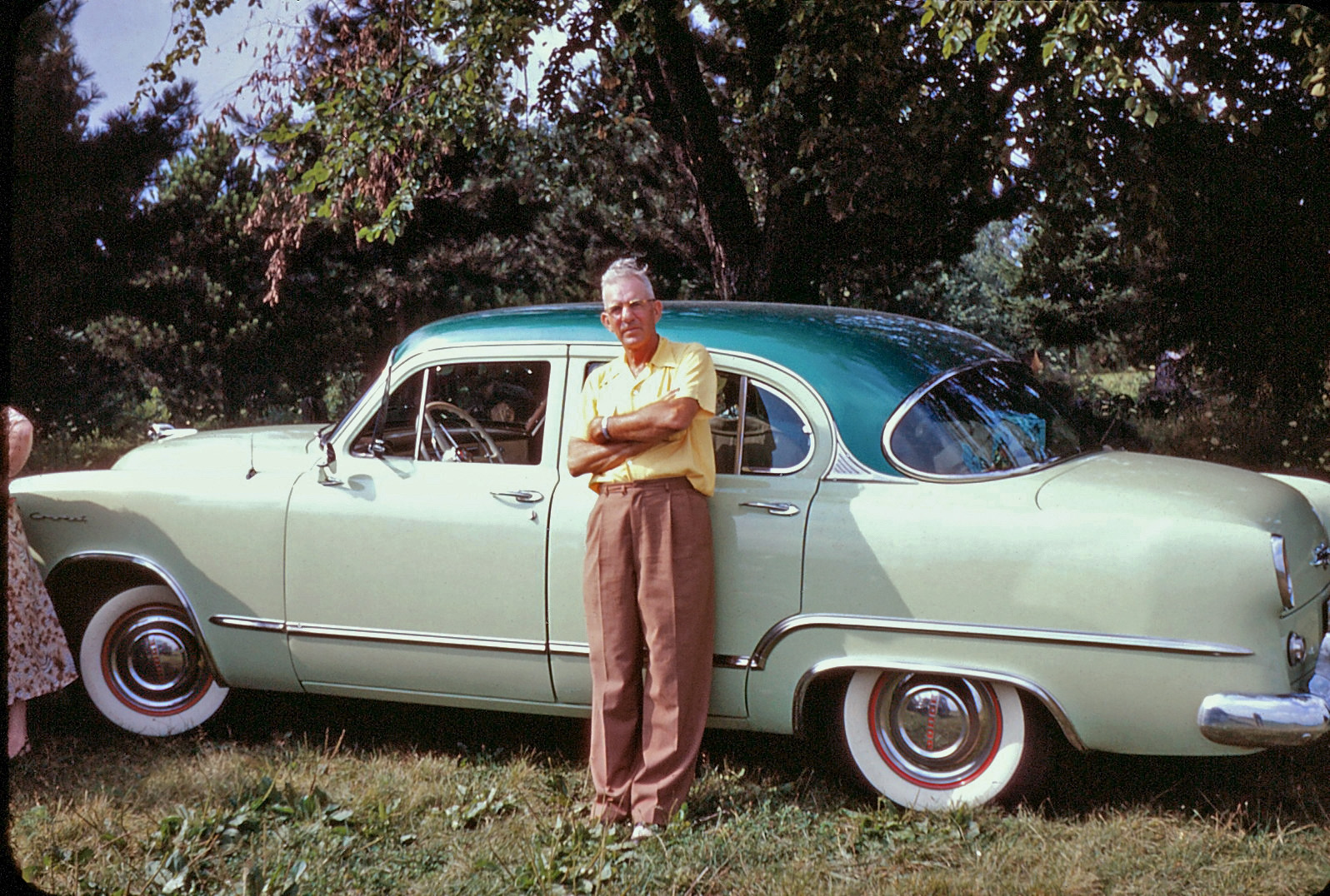 My great-uncle Dave Tunnel, in a mid-1950s Kodachrome taken near Norwalk, Ohio. He's proudly displaying his 1953 Dodge Coronet. View full size.