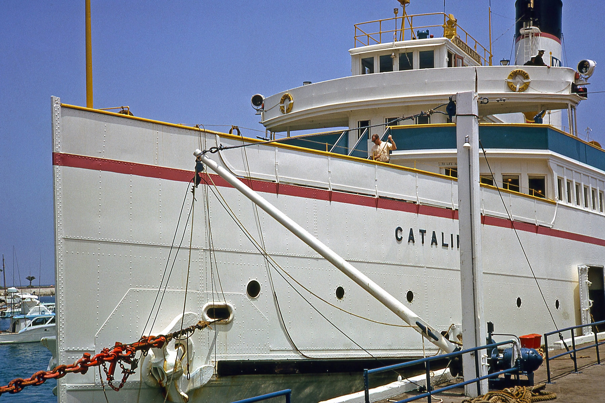 The late, lamented Great White Steamer, the SS Catalina in Avalon Harbor. Built in 1924, it was the only way to travel to Catalina Island with class. Its fate was to lie buried in the mud off of Ensenada Harbor, later to be broken up for scrap. Kodachrome slide taken by my dad in 1965. View full size.