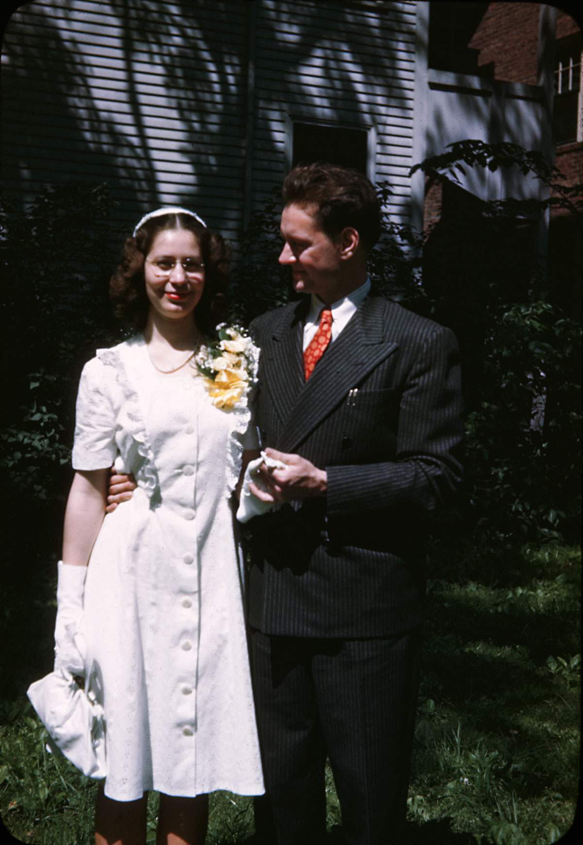 My parents, Charles and Harriet (Tyler) Miller on their wedding day, June 11, 1946. Cambridge, MA. Spiffy suit, Dad! Update: Found and posted the original Kodachrome slide - apparently Kodachrome prints were not as stable.