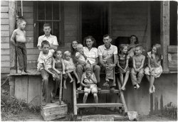 Leatherwood, Kentucky, 1964. "Entire Cornett family on porch; Willie, Vivian and twelve children." Print from  35mm negative by William Gedney. Gedney Photographs and Writings Collection, Duke University. View full size.
