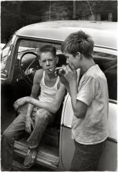 Leatherwood, Kentucky, 1964. "Cornett boys smoking by car." No after-school soccer for these lads. Print from a 35mm negative by William Gedney. Gedney Photographs and Writings Collection, Duke University. View full size.