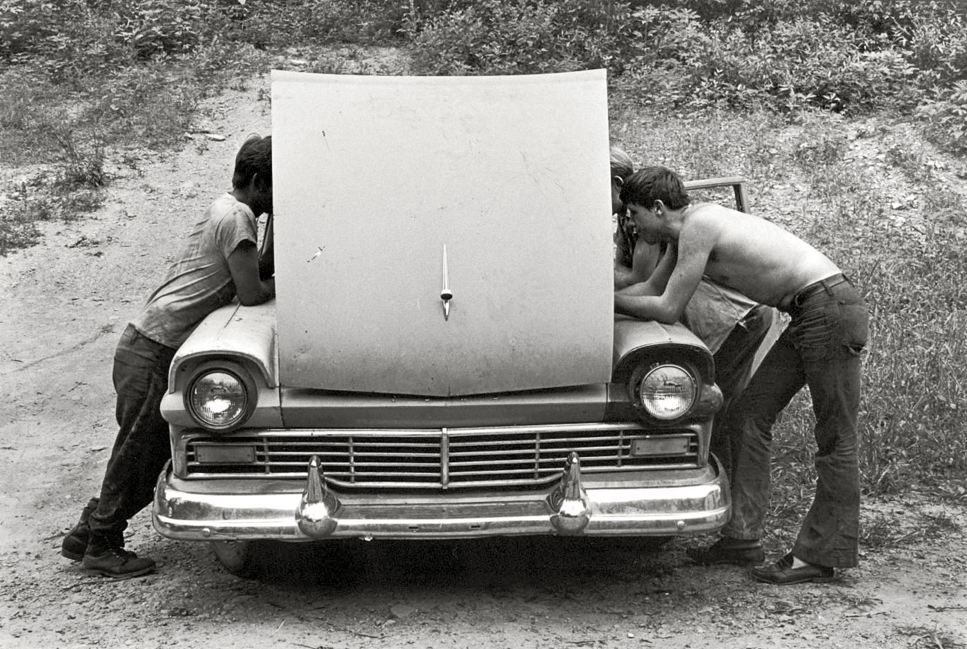 "Cornett family, Kentucky, 1972. Looking under hood of car." The Cornett men doing what Cornett men do. Print from 35mm negative by William Gedney. Gedney Photographs and Writings Collection, Duke University.  View full size.