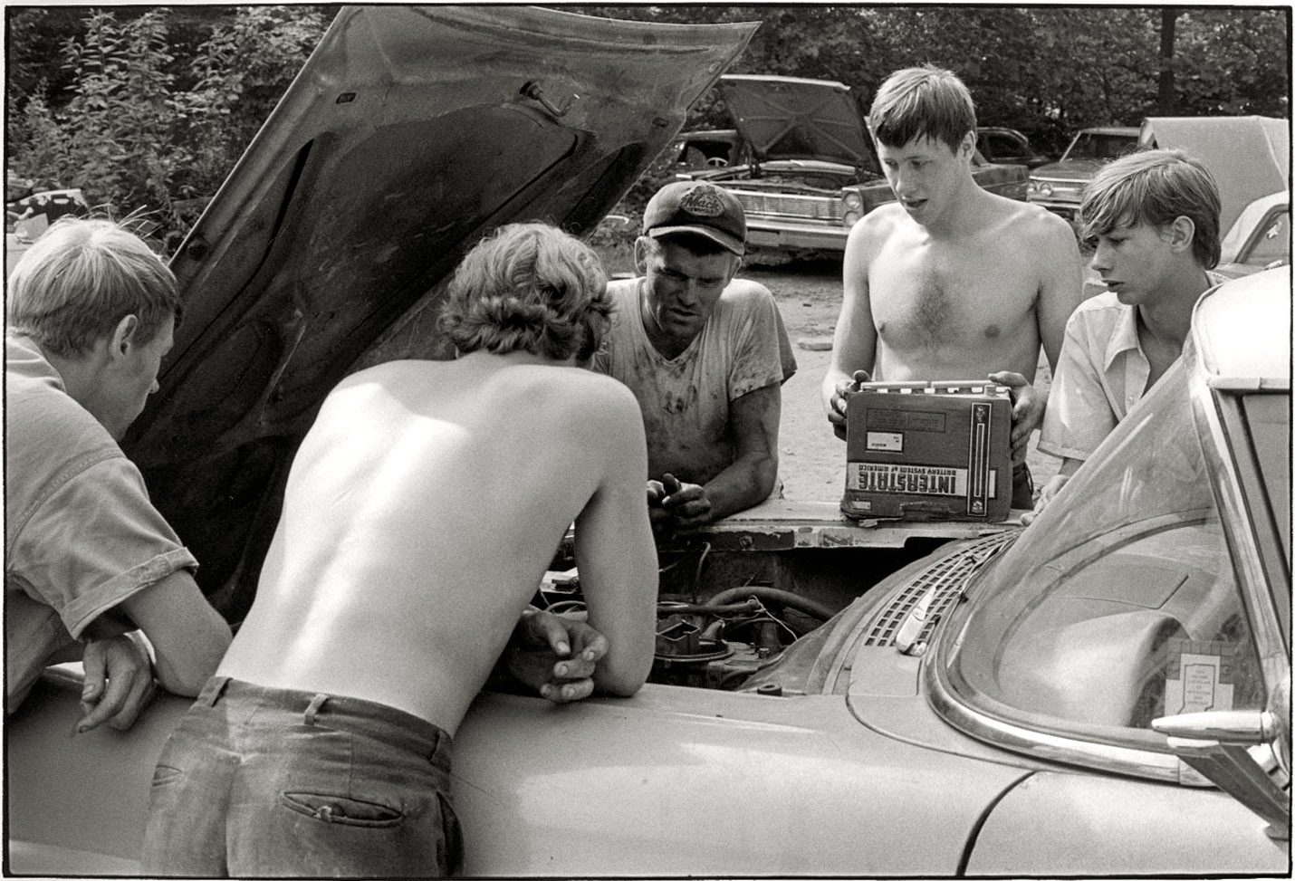 "Cornett family, Kentucky, 1972." Battery transplant for the 1957 Ford seen in the previous post from this series. Print from 35mm negative by William Gedney. Gedney Photographs and Writings Collection, Duke University.  View full size.