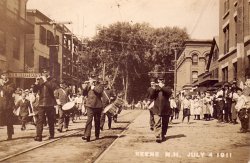 Another Real Photo Postcard -- Keene NH, July 4, 1911. Forrest Hall, F. H. Tyler, Jim Foley, and ____ Clark, piccolos; John Chapman, ___?___, Leo Tyler, drums; Mike Breen, bass drum.