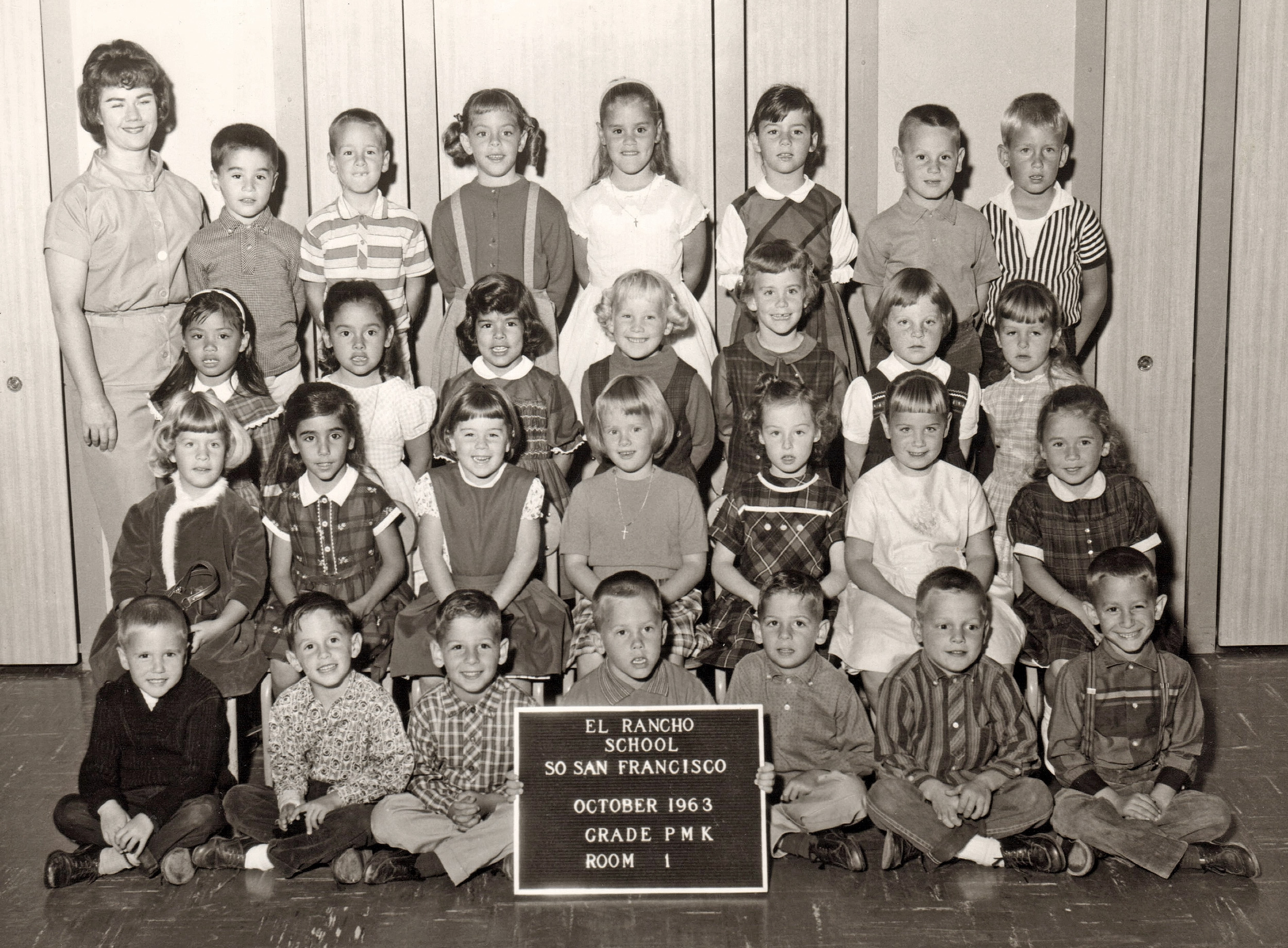 Miss Lorene Swanay's afternoon kindergarten class in California was seemingly a very happy group, with a few glum exceptions. I'm the befuddled lad holding the sign and flanked by the Tipton Twins. It's chilling to read the date on it; one month later the nation suffered a tragedy we were too young to understand. View full size.