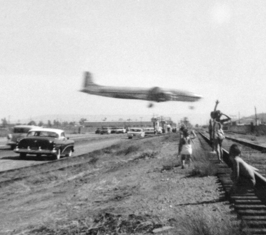 Greg Herbert remembers piling into the station wagon and the family heading down to LAX. They would make it an outing just to see the planes land. You used to get pretty close to the runaways before they built the big fences. Photo taken 1950's by Mary Herbert.
