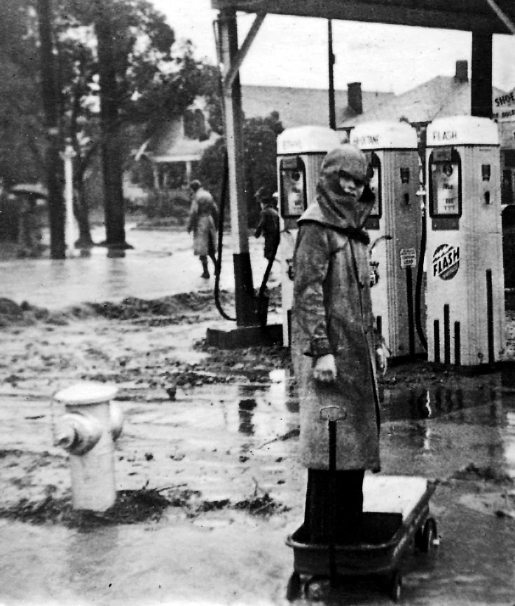The massive floods in the Los Angeles basin in the spring of 1938 led to the channelization and paving of the major rivers of LA.  Here, an unknown lad, is out exploring his neighborhood (most likely Highland Park) during one of a series of storms.  Probably not a lot of gas sold that day. My Dad would have been 19 when he took this picture. Photo: Don Hall, Sr. View full size.