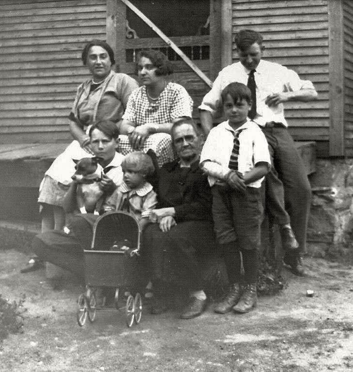This is a picture of my family in Swanton, Vermont circa 1926 shortly before they moved to Underhill, Vermont. From left to right top is Nellie Boss Lamphere, then Mary her sister and Frank Lamphere.
Nellie and Frank were my grandparents. At the bottom is, again from left to right, my Uncle Lynford, with the little girl (my mother) Lynette Lamphere being held by my maternal great-grandmother Marceline Bourgeois. The little boy on the far right is Fayette Lamphere who tragically died in World War II.
My grandmother Nellie changed her name from Bourgeois to Boss when she moved from Québec to Vermont. My grandmother Nellie and her sister Mary were members of the Abenaki Indian Nation in Swanton.
