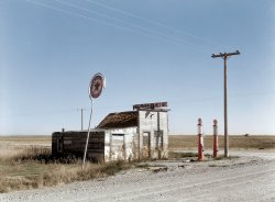 Colorized from a Shorpy original.
 View full size.
Great colour!This looks like a 1950 photo of an abandoned gas station leftover from the 1930s!  Great colorization.
Like itvery nice job right down to the green T on the sign.
Super Job!That may be the most successful colorizing job I've ever seen. It looks like a photo from a color negative.
--Jim
Thank you!Thanks all, I was really inspired by the subject and composition and couldn't resist. Much more to come, I can't help myself with the amazing images on here.
Nailed it!Very inspiring. nice job
(Colorized Photos)
