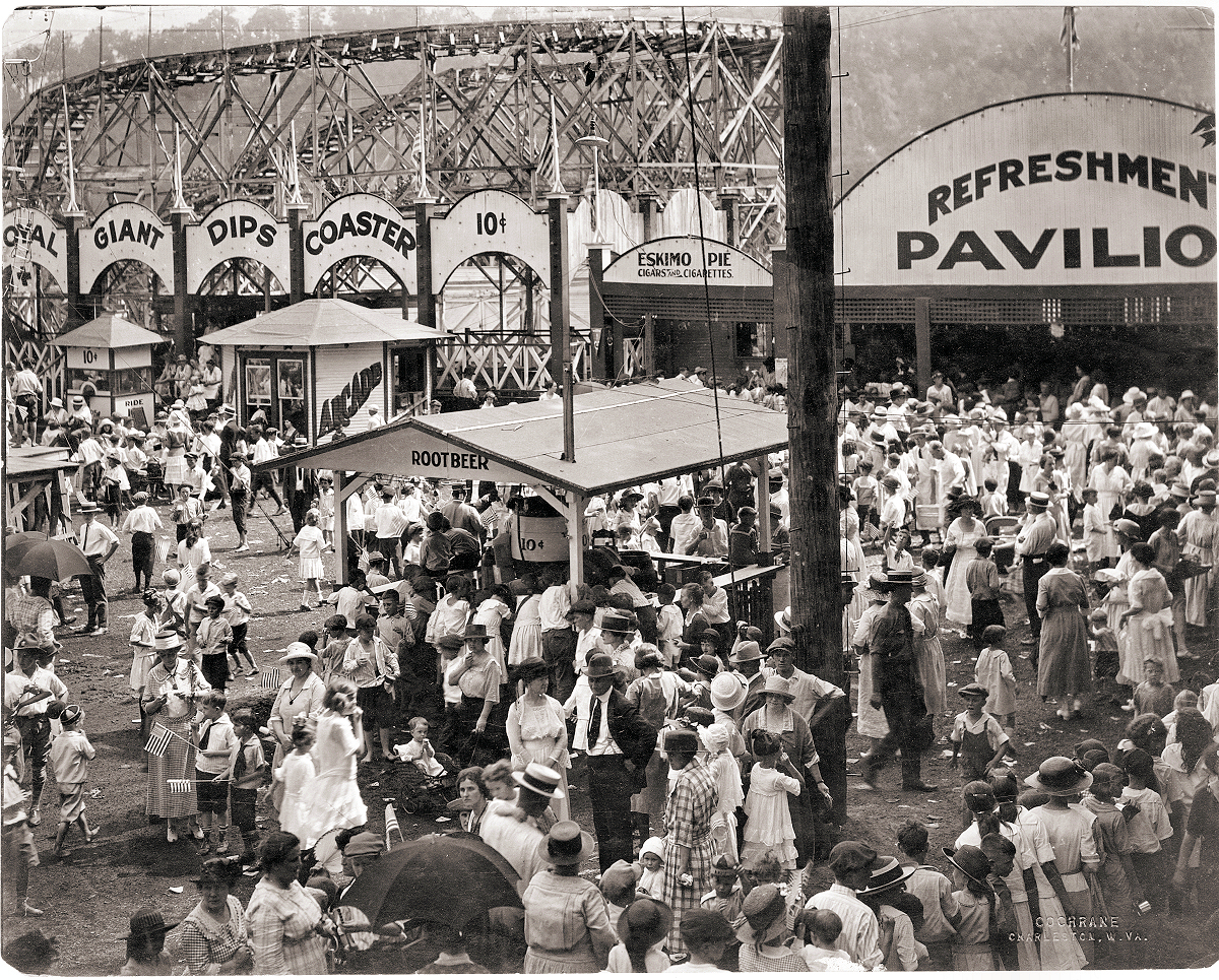 Luna Park in Charleston, West Virginia, around 1915.  There were many Luna Parks in the U.S., the most famous at Coney Island in New York. This photo is believed to have been taken on the Fourth of July, due to the dress of some of the people (like Uncle Sam).  The Park, like many Luna Parks of the day burned down, and was never replaced.  The strange streets that are still in use to this very day in Charleston where Luna park stood, are a direct reflection of the walkways there. Today, hundreds of homes sit in its place. Original photo by Cochrane. View full size.