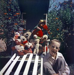 Summer 1953. Here I am, just turned 7 and lacking the full complement of front teeth, with my teddy bears in our back yard in Larkspur, California. The big red one is Rufus, who I won at a church festival, at one of those booths with a spinning wheel and a row of numbers along the counter. Someone gave me a dime to plunk down on one and the wheel stopped on mine. They pointed to all the prizes on the shelf and asked me what I wanted. My eyes bugged out and I pointed and yelled "I want HIM!!!" There's also a Frosty the Snowman and Smokey the Bear. From a 2-1/4 square Kodacolor negative.