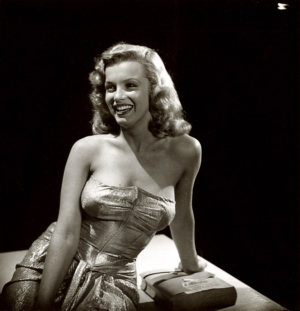 Hollywood, February 1947. "Movie starlet Marilyn Monroe." And the world's luckiest phone book. Photograph by J.R. Eyerman. View full size.