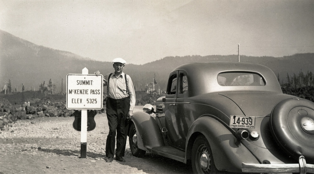Ernest Frye with his 1935 Dodge coupe at McKenzie Pass summit in Oregon, He was probably headed over into Central Oregon on a deer hunting trip. View full size.

[Who was he? A relative? Family friend? Do you know who took the photo? -tterrace]