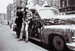 I had been hanging out at the folk clubs in Greenwich Village many years before this was taken. In the photograph I was fresh in from Santa Cruz, CA, and had my "Psychedelic" '47 Ambulance parked on MacDougal Street about in front of the long gone but not forgotten Gaslight Cafe. Note the upper cockpit and windscreens where you could sit high (no pun) and watch the world go by. The rotating radar antenna is fully operational. Bought at a city auction in Santa Cruz. I was three miles away from Ken Kesey's place in Soquel -- and now you know where the color scheme came from. View full size.
Kid CharlemagneCool!
Nice CarLooks like a photo you might find on the back of an old Dylan album.
Ramblin Jack in his 1949 Midwood High School YearbookRamblin Jack, nee Elliot Adnopoz, in his 1949 Midwood High School Yearbook, Brooklyn. His address would have put him in the Erasmus Hall HS district, but for some reason, he went to Midwood.
(ShorpyBlog, Member Gallery)