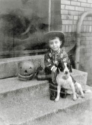 A rough Polaroid surviving from 1964, me and my best dog Mitzi, getting ready for Halloween. Taken at the rear of 450 East Walnut Street, Chatham Arch neighborhood of downtown Indianapolis.
A boy and his dogSo much love in this picture. Every kid need a great dog. 
(ShorpyBlog, Member Gallery)