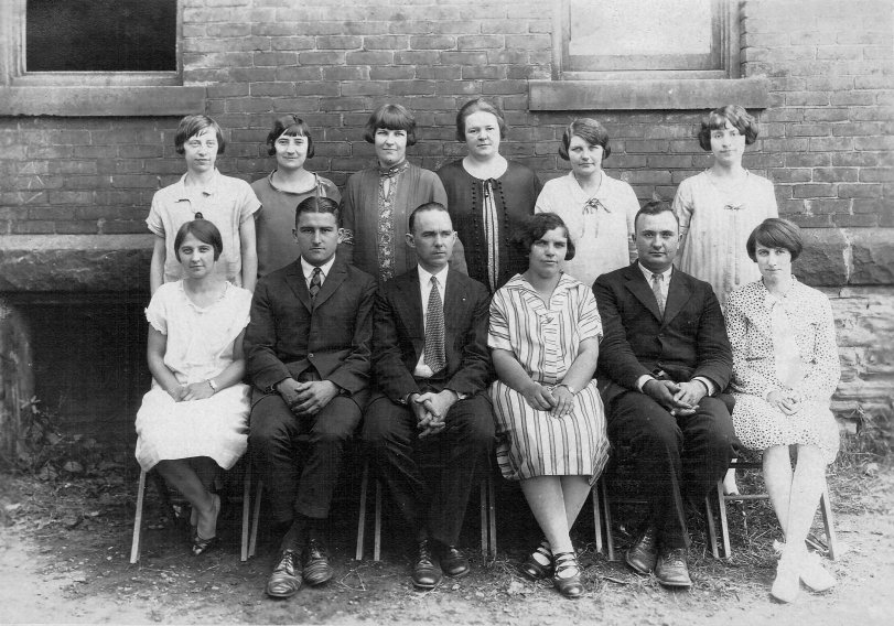 Since posting the picture of Miss Maude and her class, I've found more information. This was actually around 1930 as I have a newspaper clipping from Oct. 1930 announcing her home for a visit on a break from teaching at Fairland, Indiana, in Shelby County. 

This image of Miss Maude and her fellow teachers includes names of the teachers on the back. 

Top Row, left to right: 
Miss Nevil, 3rd Grade. Leah Canus, 2nd Grade, Terre Haute, Indiana. Miss Gill, 5B. Mrs. Luke, 5A. Miss Wood, 1st Grade. Mabel Wagner, H.S. Principle (one of our four). 

Bottom Row, left to right: 
Lucille, (my roomy), 6th grade. Mr. Miller, 8th. Mr. L. Johnson. [Miss Maude McMahan, 4th grade?]. Mr. Axe, H.S. Coach. Miss. McClain, 7th.  