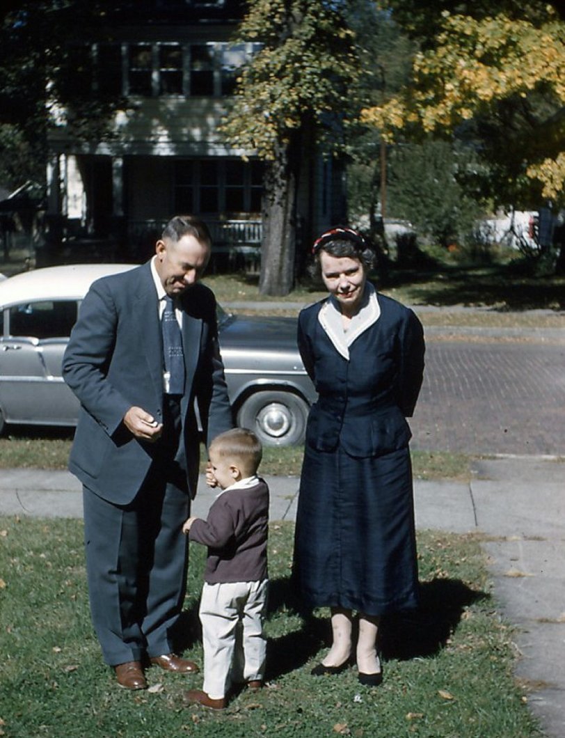 At one time it was considered proper to dress up before going to visit someone. My grandparents came to our house in Jefferson Park (NW Chicago) in 1954 where this 35mm Kodachrome was taken. I don't know what kind of car that is.
I wonder what my grandparents would have thought about how sloppy people dress, in public, today....I think I know. View full size.
