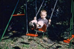 I was dressed nicely for this activity. We must have had important visitors. This was in Clinton, Iowa, 1956 or 1957. I remember the red and green swing set and the fencing material seen near the teeter-totter, as being from that back yard. Another of many 35mm Kodachromes. View full size.
(ShorpyBlog, Member Gallery)