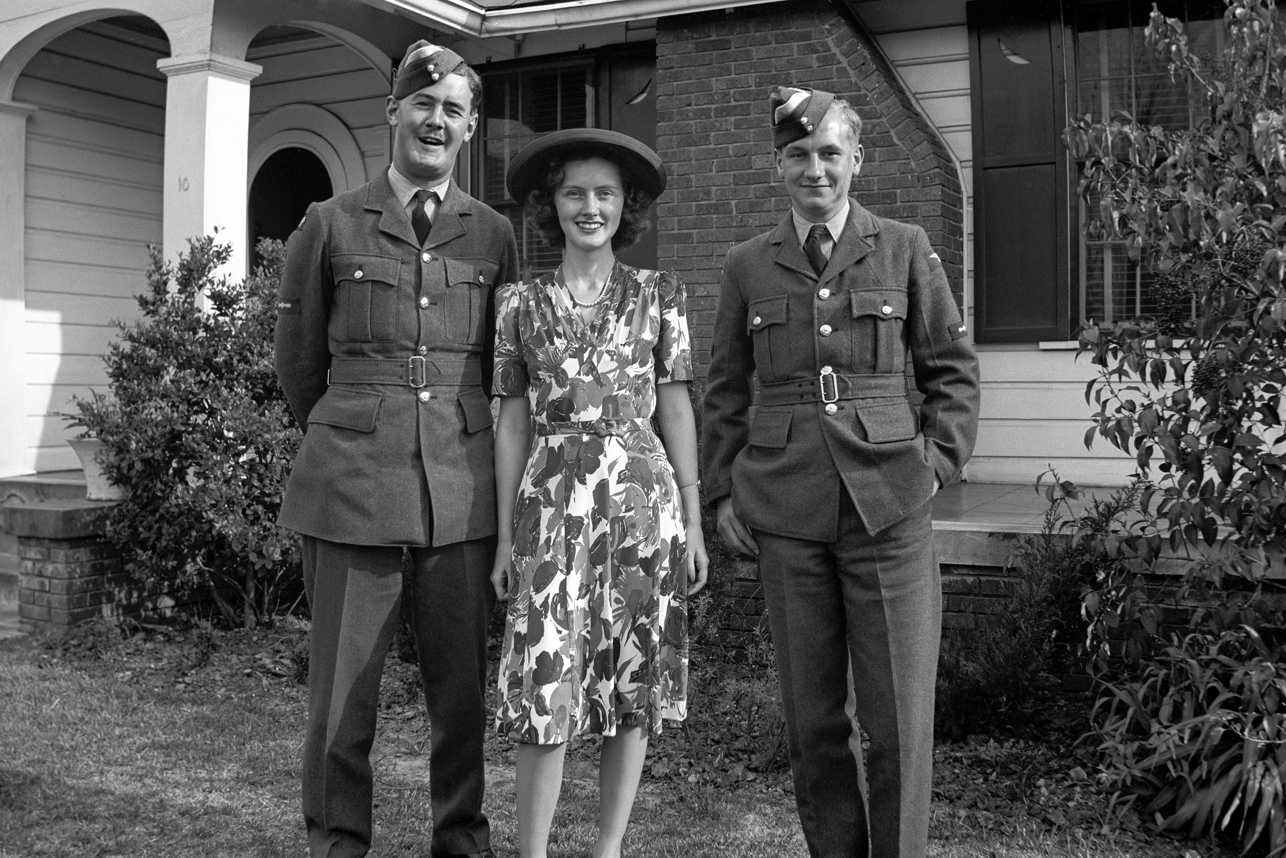 My mother with two British soldiers, in the USA during WWII. Scanned from the nitrate negative. View full size.