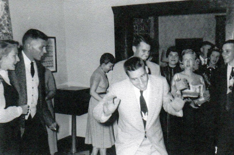College students at the University of Delaware at Newark, DE, learning how to do the "Hokey Pokey" at a party at the Delta Tau Delta fraternity house in the Spring of 1955. View full size.
