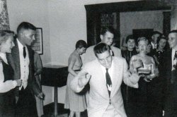 College students at the University of Delaware at Newark, DE, learning how to do the "Hokey Pokey" at a party at the Delta Tau Delta fraternity house in the Spring of 1955. View full size.
(ShorpyBlog, Member Gallery)
