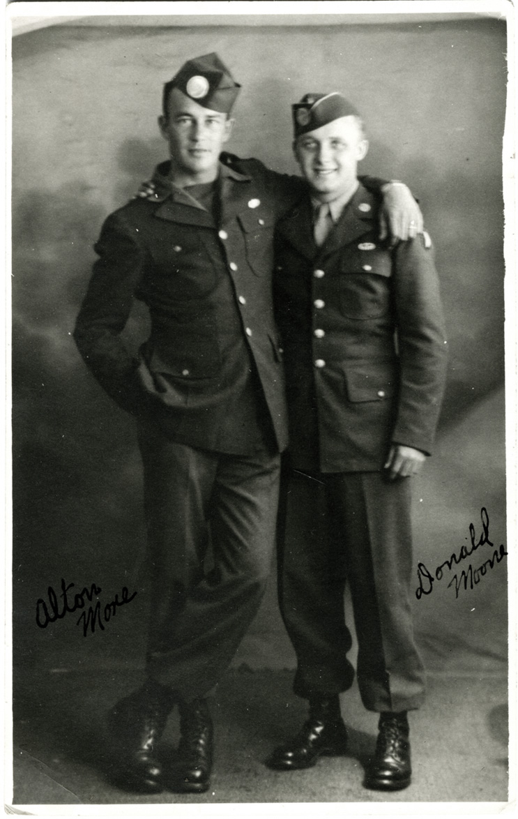 My father-in-law, Ed Mauser, served with Easy Company, 506th Parachute Infantry Regiment, 101st Airborne Division, better known as "The Band of Brothers" during WW2. He passed in January 2011 and we discovered this photo while going through his papers. It's of two other members of the "Band of Brothers."  We believe it was taken in 1943 at a studio in England between D-day and the jump into Holland. The two soldiers in the photo are Alton More and Donald Moone. View full size.