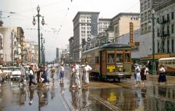 Anyone who's ever been to New Orleans in the summer knows that it rains about once per hour, followed by hot, sunny, humid weather.  On June 15, 1957, I made a short stopover in New Orleans en route to ROTC Summer Camp.  Shooting the original Kodachrome I at ASA 10, most of the slides I took in the rain came out overexposed, something practically unheard of in those days of slow speed film.   But somehow I lucked out on this particular exposure, catching the pedestrians dashing between the raindrops with the sun peeking out overhead on Canal Street at St. Charles. 35mm Kodachrome by William D. Volkmer. View full size.