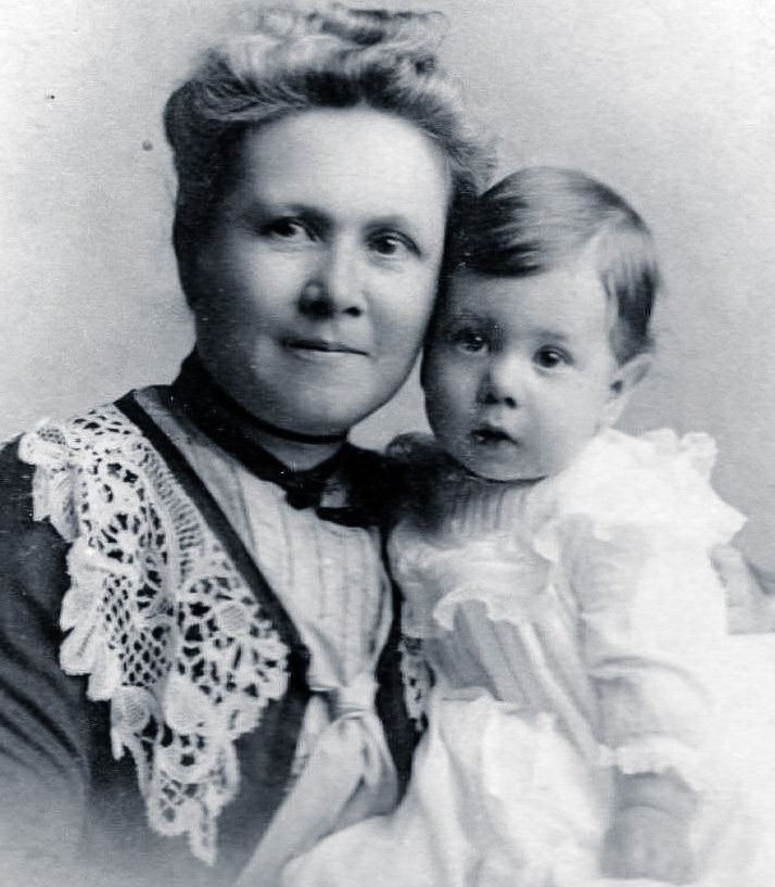 This cabinet photo was taken in 1902 in Brooklyn, New York. That's my paternal grandmother, Margaret Dunlap McNeal Wilson, who was born in Newburgh, New York in 1865 and died there in 1950. The toddler is her only child and my father, Robert John Wilson (1901-1986). Sadly, she lost her husband and he, his father, Samuel Hugh Wilson (1855-1903), in April, 1903, after only four days of illness (pneumonia). View full size.

