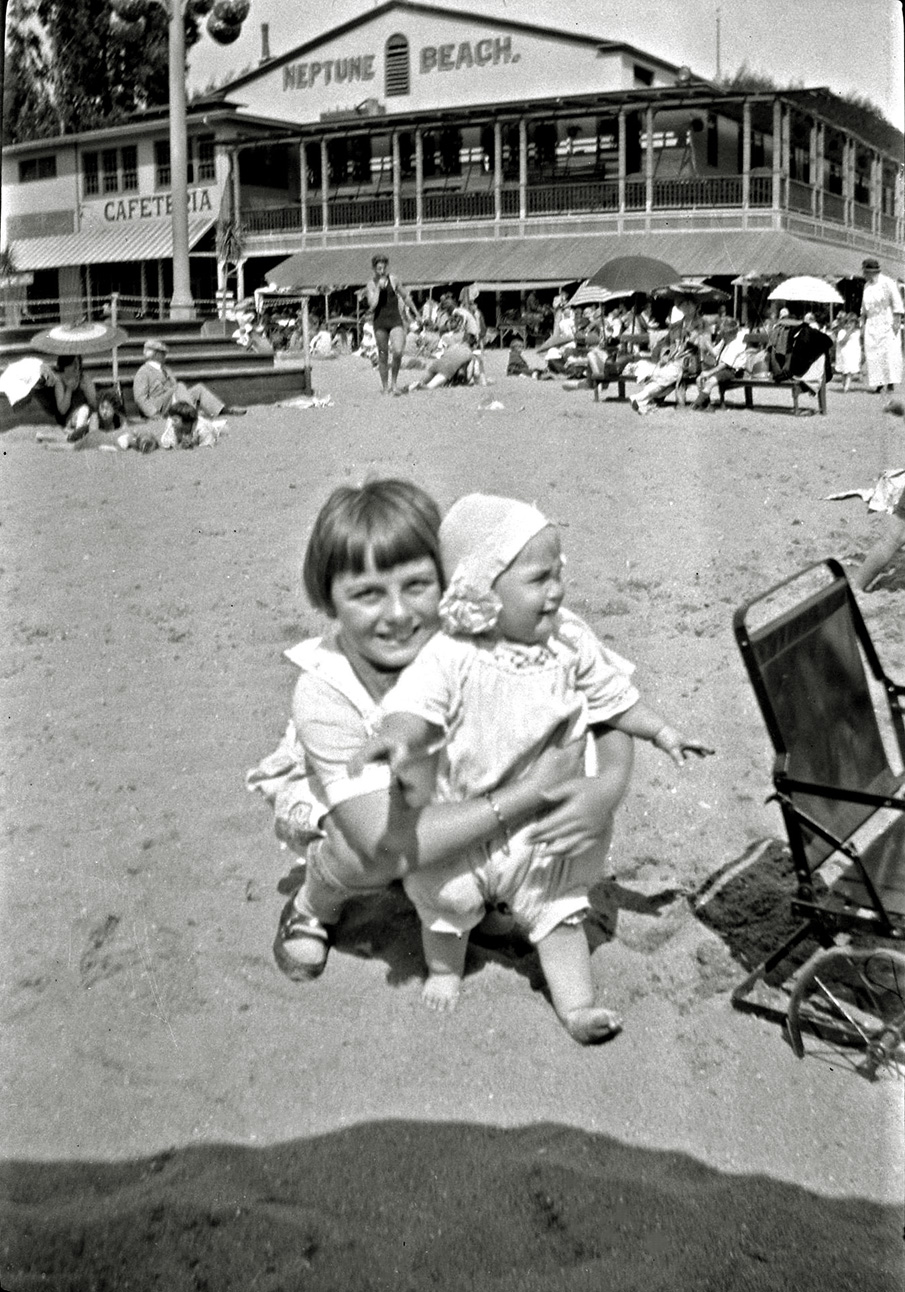 Neptune Beach amusement park in Alameda, California. I have a whole box of negatives from this family and based on the hairstyle and some of the other photos in this series, I'm guessing this is late 20s early 30s. View full size.