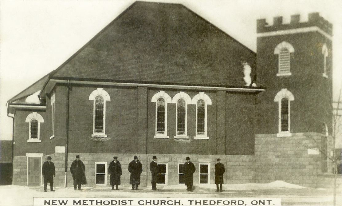 Written on the back of this photo left to right: F. Traver, G. Lsird, B. Oliver, H. Traver, C. Rhumford, Rev Reid, A. Rumford. Note the different spelling of Rumford. View full size.