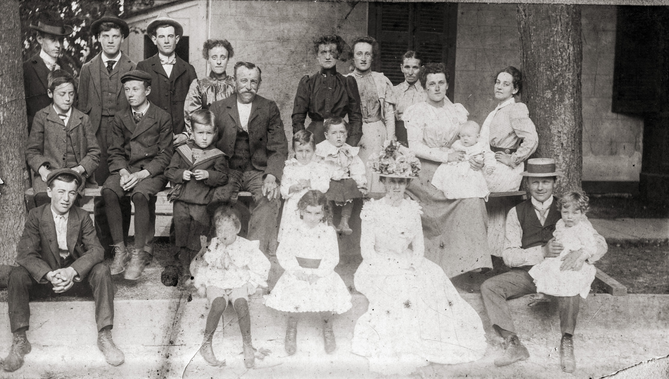 This is a portrait of our extended family circa 1900 at Niagara-on-the-Lake, Canada. They operated the Union Jack Canning Company which during that period canned, under the Union Jack brand, fruits and vegetables from the Niagara Peninsula such as peaches, pears, cherries, tomatoes and green beans. (Framed period labels of the cannery adorn our kitchen wall.) I remember my dad and his cousin Elizabeth from Niagara finding and opening a can of tomatoes from the cannery in the late sixties - it looked O.K - but nobody dared to try it.

Second from left in the second row is my paternal grandfather, who ran a grocery store in Niagara from the early 1910s to the 1960s - seen here with me as a kid sitting on the front store steps in the late 1950s. Next to him, the child, I believe, is the future first head of Regional Niagara government in the late-1960s. View full size.