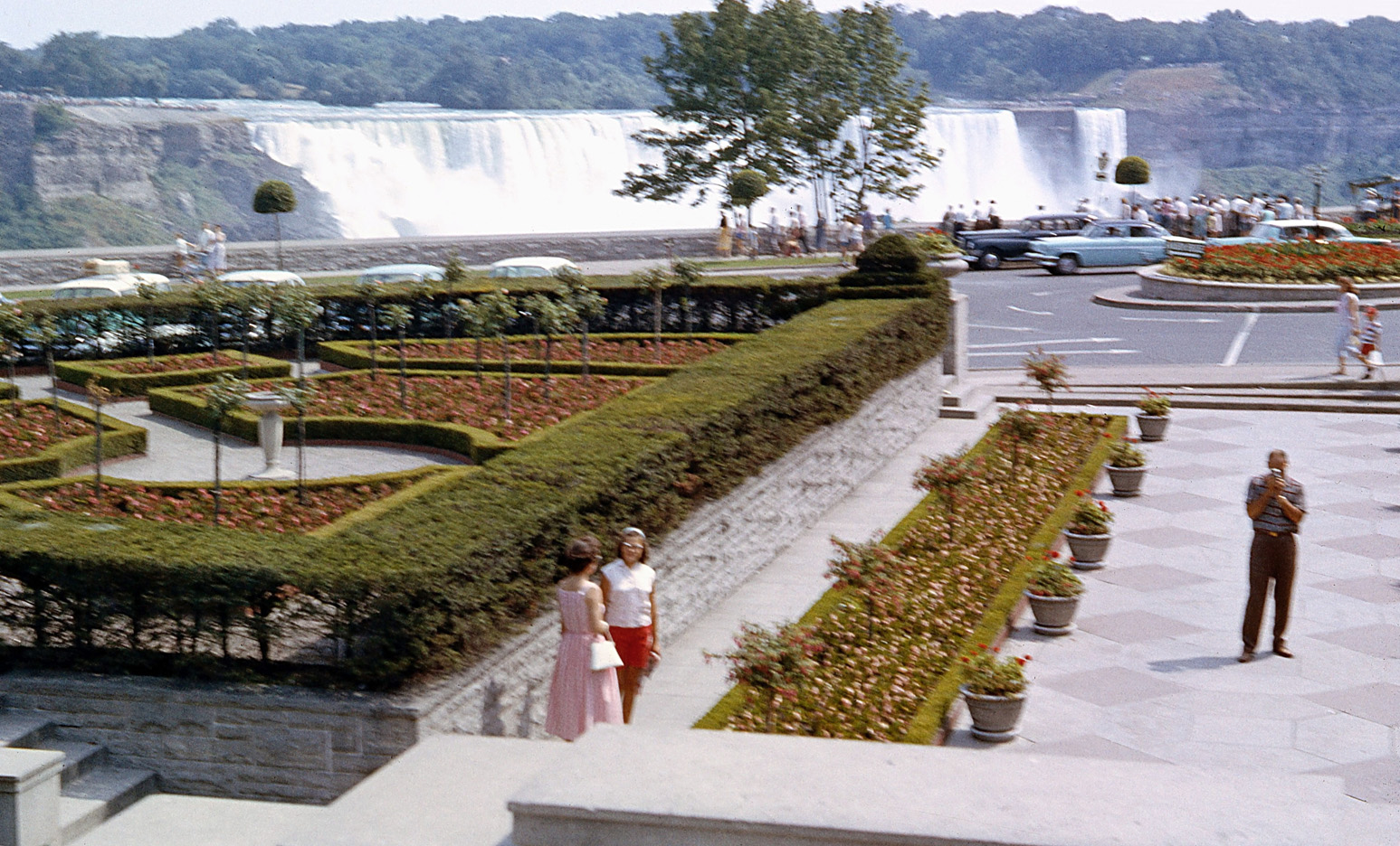 Another photo my Dad took in summer 1958 at Niagara Falls on the Canadian side (a row of autos was in the previous photo I submitted). Although somewhat fuzzy, it shows the period well. At 8 years old, I think I was beside him when he took this shot. The then-recent (1954) slide on the American side is seen again, an event well related by a viewer of the last picture here at Shorpy. View full size.