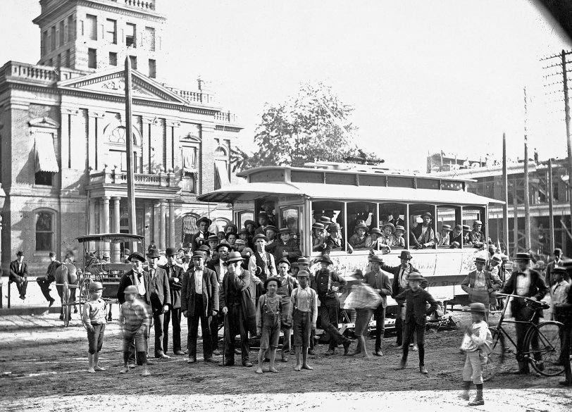Norwalk, Ohio, somewhere between 1885 and 1905. What appears to be a new trolley service in front of the county courthouse. The side of the trolley reads: East Chestnut via Water St. From my grandfather's collection. View full size.
