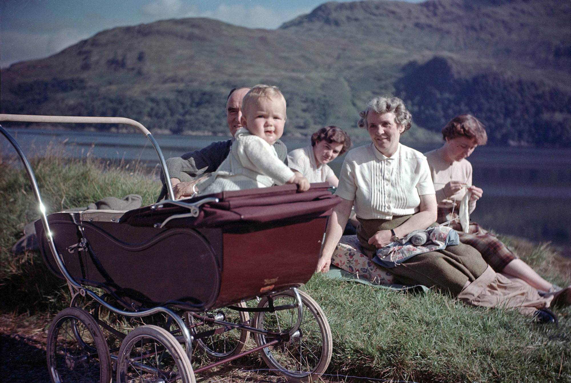Near Letterfearn, Wester Ross, Scotland, 1954. My mother is knitting, my grandparents are also in shot. View full size.