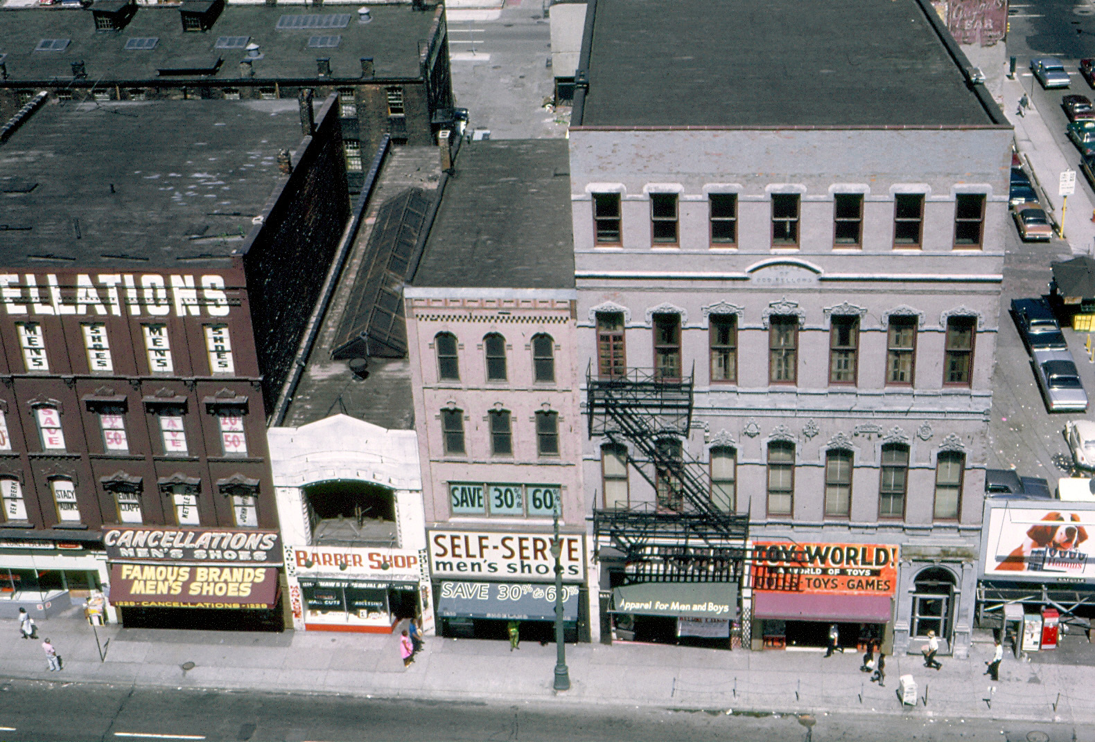 The building on the right is the former Odd Fellows Temple, built in 1874 at the northeast corner of Randolph and Monroe Streets in Detroit, Michigan.  Today it houses a Buffalo Wild Wings restaurant.

This is a scan of a Kodachrome transparency that was taken in July 1968 from the roof of Crowley's Department Store, which was demolished in 1978. View full size.