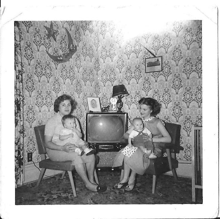 This is my Grandma Norma, left, holding my mother Marsha. Next to her is an old friend and her child. This was taken in the living room of the house my grandparents still live in. Newark, Ohio, 1955. View full size.